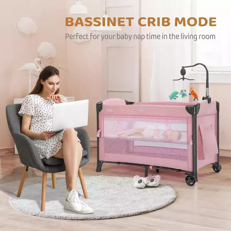 JOYMOR Baby Bedside Bassinet, Baby Bassinet, Pack n Play Convert Playpen, Quick Foldable Travel Bed, Wheels & Brake, Carry Bag for Boys Girls (Pink)